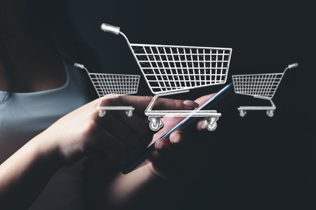 girl makes online purchases by phone. basketの写真素材