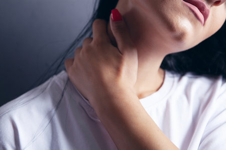a young girl has a neck acheの写真素材