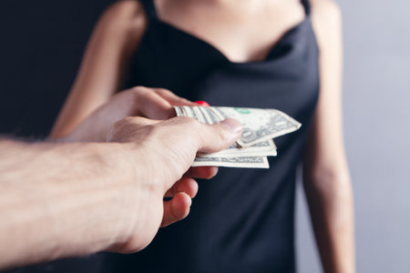 gives money to a womanの写真素材