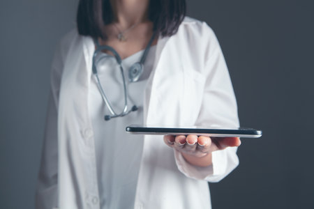 young doctor holding a tabletの写真素材