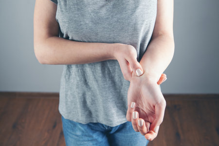 a young girl has a sore wristの写真素材