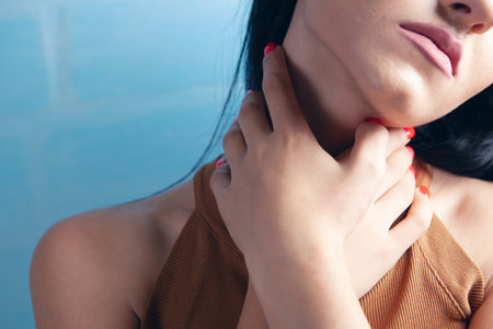 a young girl has a neck acheの写真素材