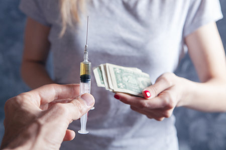 the girl gives money for the syringe