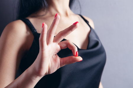 young woman showing ok gestureの写真素材