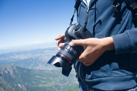 the photographer is standing on the mountain