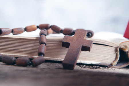 open book and cross on the tableの写真素材