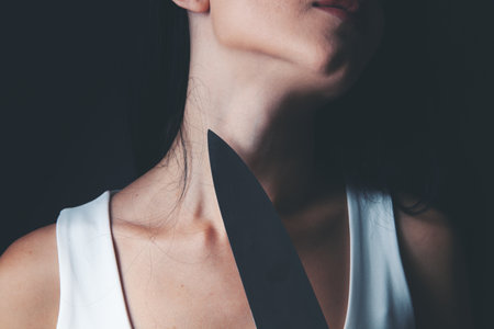 threatens a woman with a knifeの写真素材