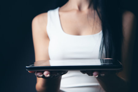 woman holding tablet as a standの写真素材