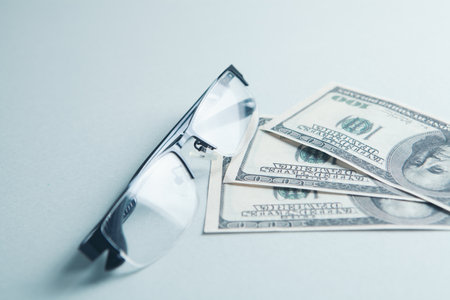 glasses and banknotes on the tableの写真素材