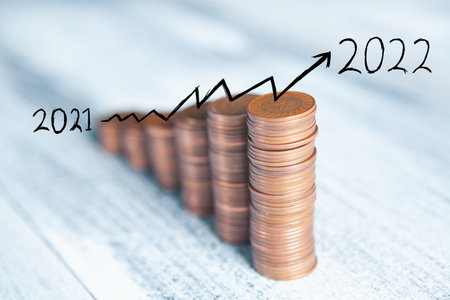 coins on the table in the form of a growing graph 2021-2022
