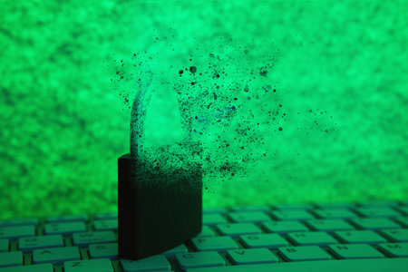 locked the keyboard is unlocked. opening the lock on a green backgroundの写真素材