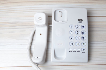 white home phone on the tableの写真素材