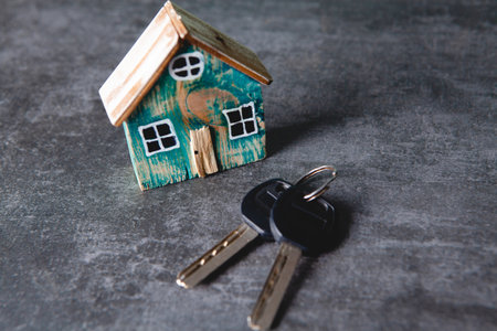 small house and keys on the table