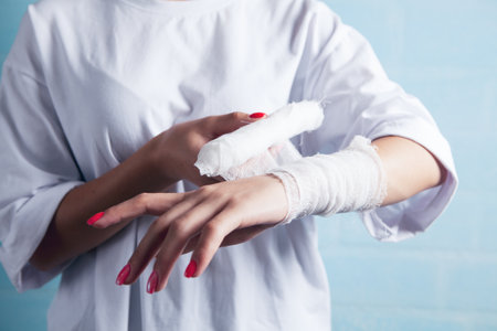 young girl bandages her handの写真素材