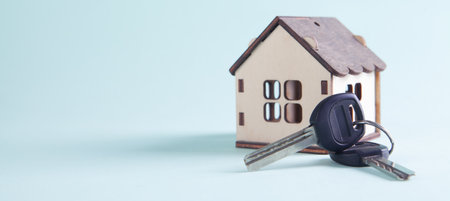 small house and keys on the table