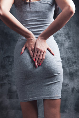woman holding ass. hemorrhoid conceptの写真素材