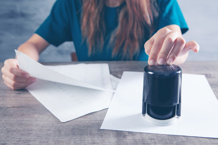 leaves woman stamp on paperの写真素材