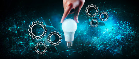 holds a light bulb in his hand and next to it there are gears