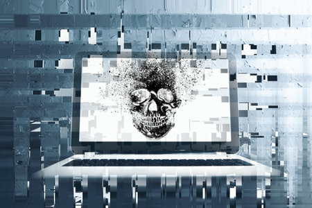 a skull is displayed on a laptopの写真素材