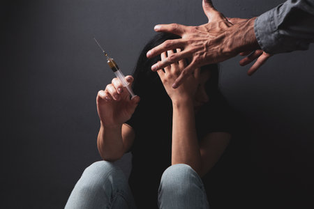 husband yells at his wife a drug addictの写真素材