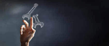 man presses on the wrenches. concept technical supportの写真素材