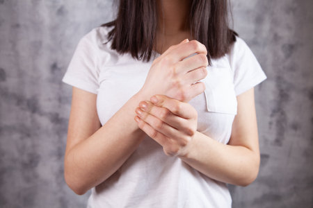 a young girl has a sore wristの写真素材