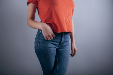 young woman posing in jeansの写真素材