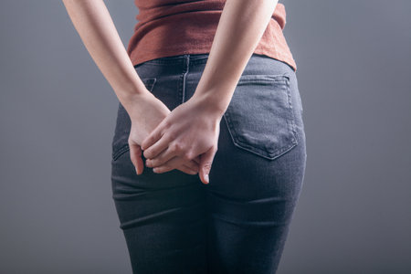 woman holding ass. hemorrhoid conceptの写真素材