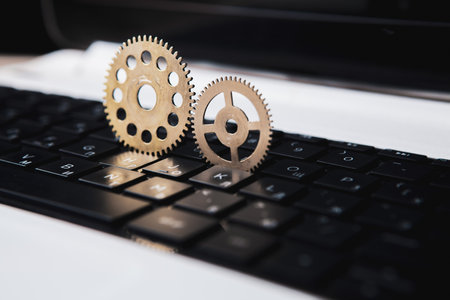 gears on a laptop. concept mechanism of workの写真素材