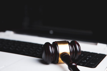 gavel of the judge on the laptop. online auction