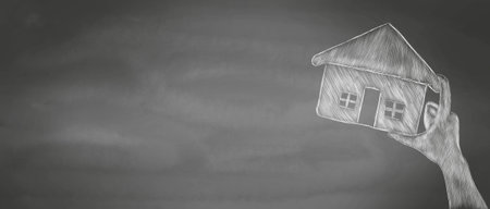 hand-drawn hand holding a house.の写真素材