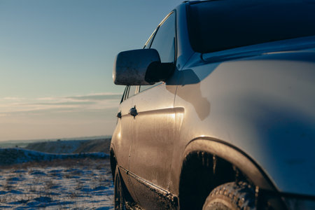 The four-wheel drive car of the modern SUV remains on the side of the winter road.