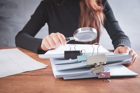 woman checking papers on the desktop