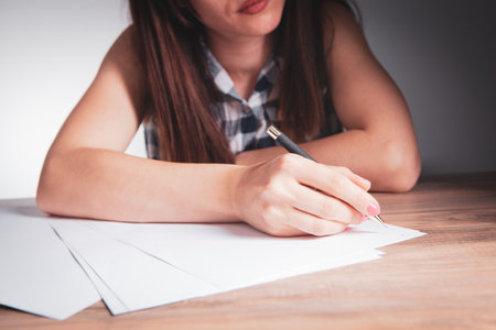 woman taking notes in papers