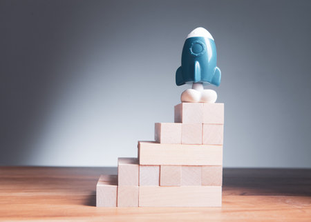 rocket ladder made of wooden cubesの写真素材