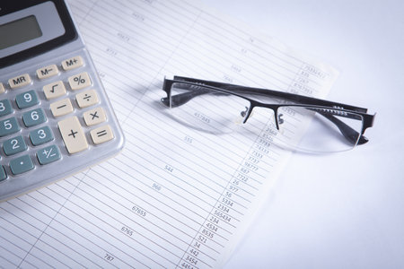 Close up calculator and financial report - accounting conceptの写真素材