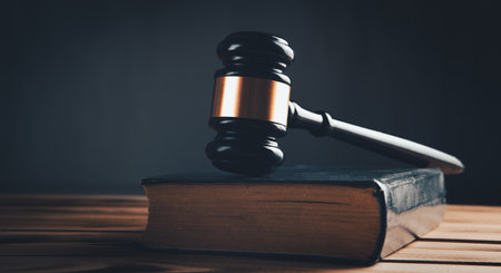 judge gavel with book on wooden backgroundの写真素材