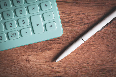 Close up calculator and financial report - accounting conceptの写真素材