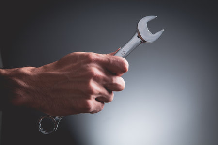 Hand wrench and Service icon from lines, triangles and particle style design.の写真素材