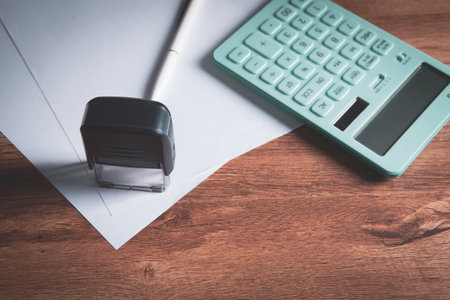 Close up calculator and financial report - accounting concept