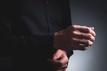 Fron view caucasian man putting on blue casual shirt,の写真素材