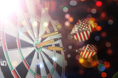 colorful darts on dart boardの写真素材