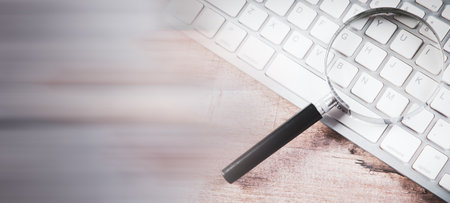 Internet search concept, magnifier and computer keyboardの写真素材