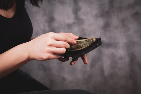 girl holding money in her hands