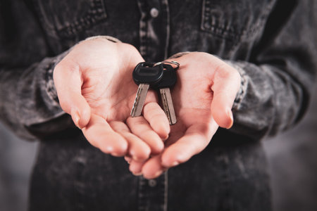 young girl holding a keyの写真素材