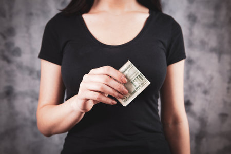 girl holding money in her hands
