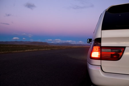 traveling by car on a long roadの写真素材