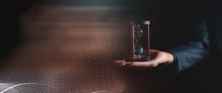 man holding an hourglass in his hand