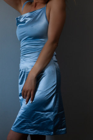 young woman in a black dressの写真素材