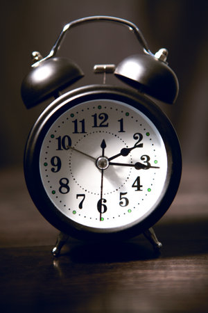 alarm clock on the black backgroundの写真素材